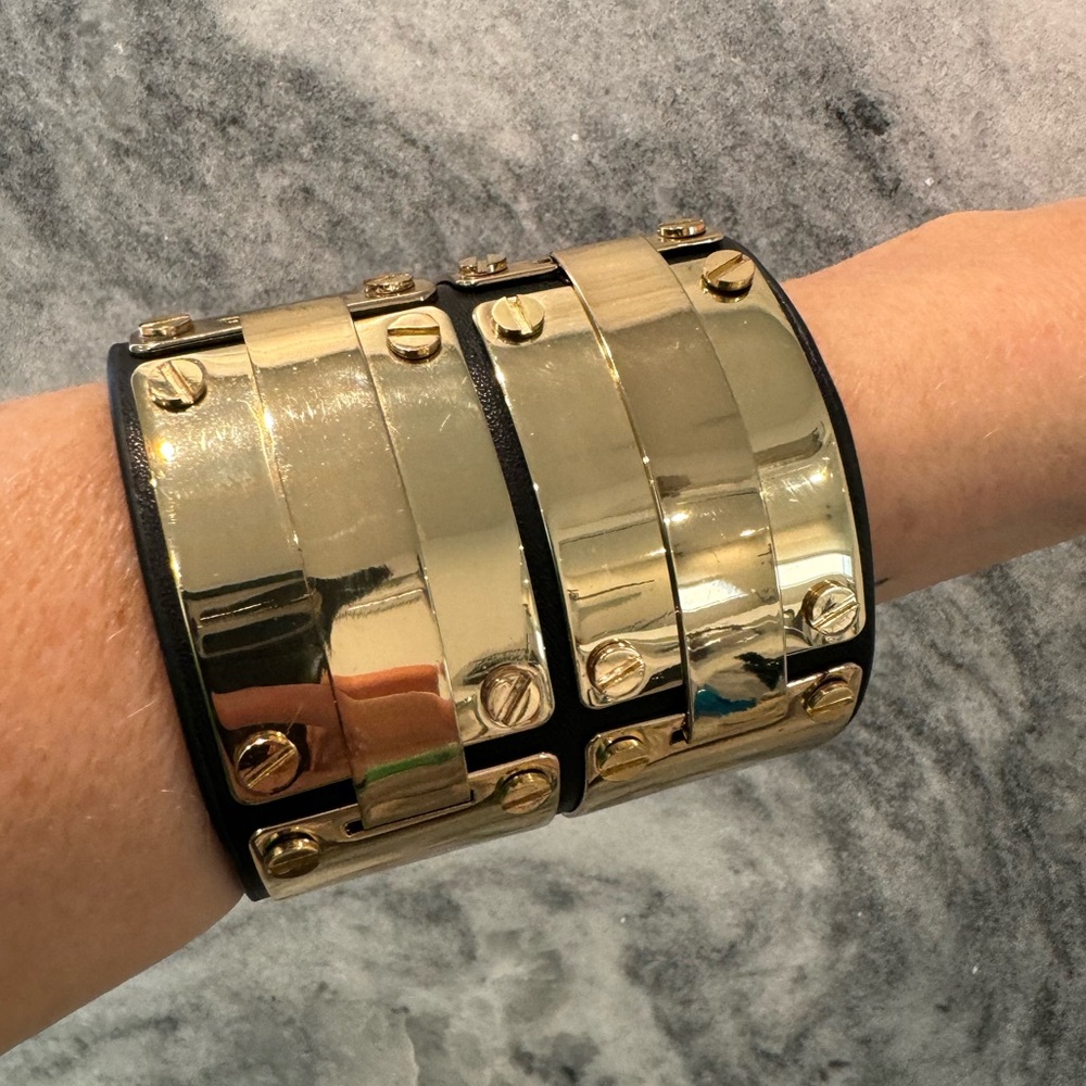 BCBGMAXAZRIA shiny gold and sueded leather metal cuff bracelet